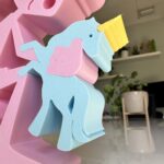 Girl Playing with Unicorn