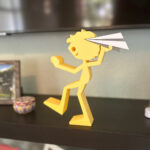 Boy Throwing Paper Airplane